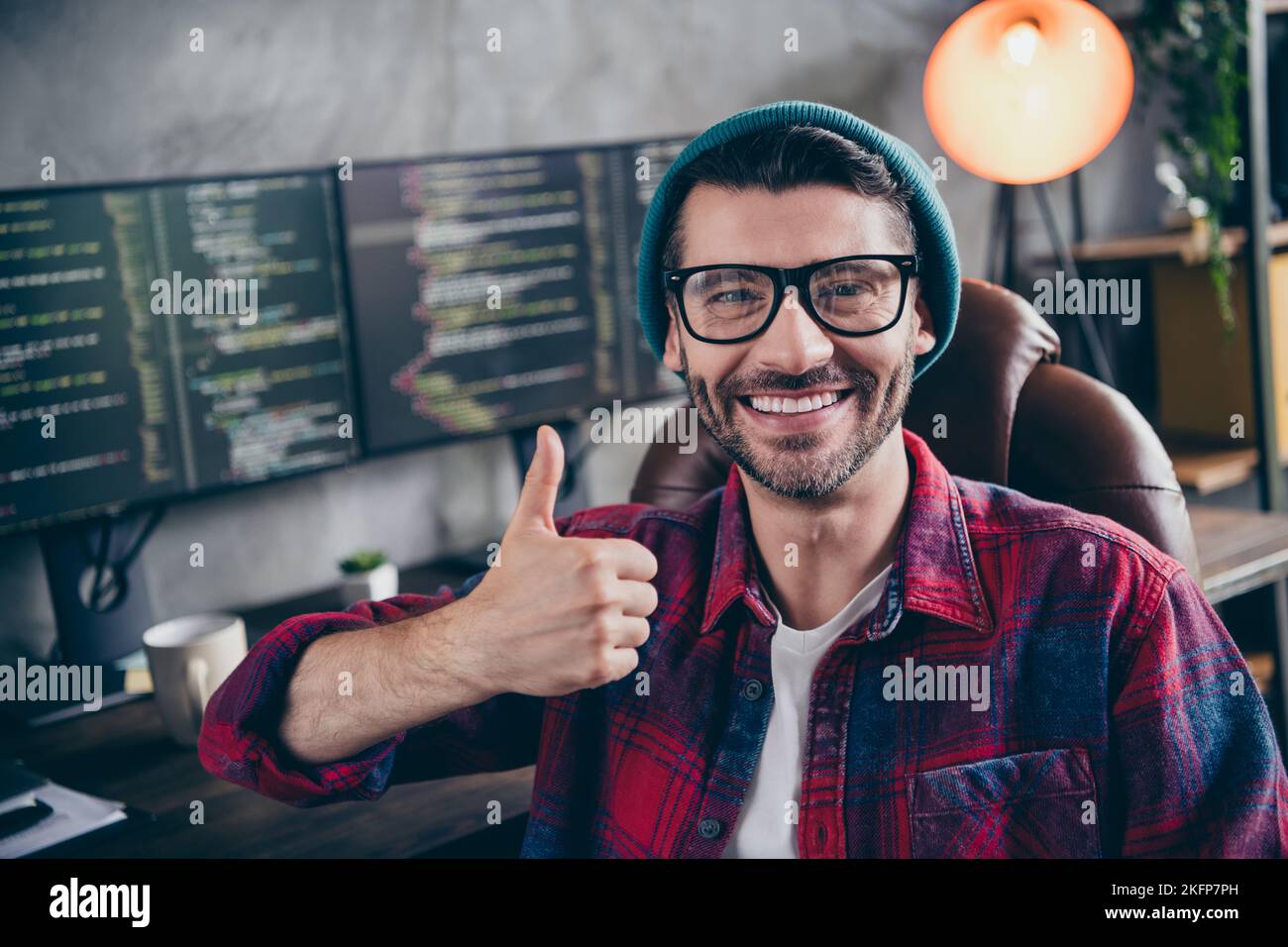 Photo of smiling cheerful guy dressed eyewear showing thumb up rating ...