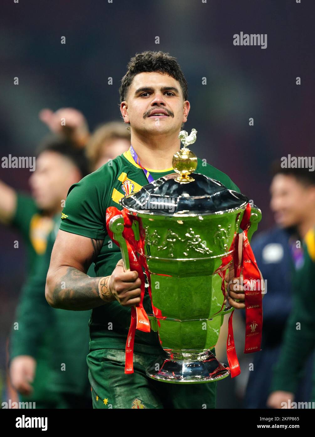 Australia's Latrell Mitchell celebrates with the trophy following the Rugby League World Cup final at Old Trafford, Manchester. Picture date: Saturday November 19, 2022. Stock Photo