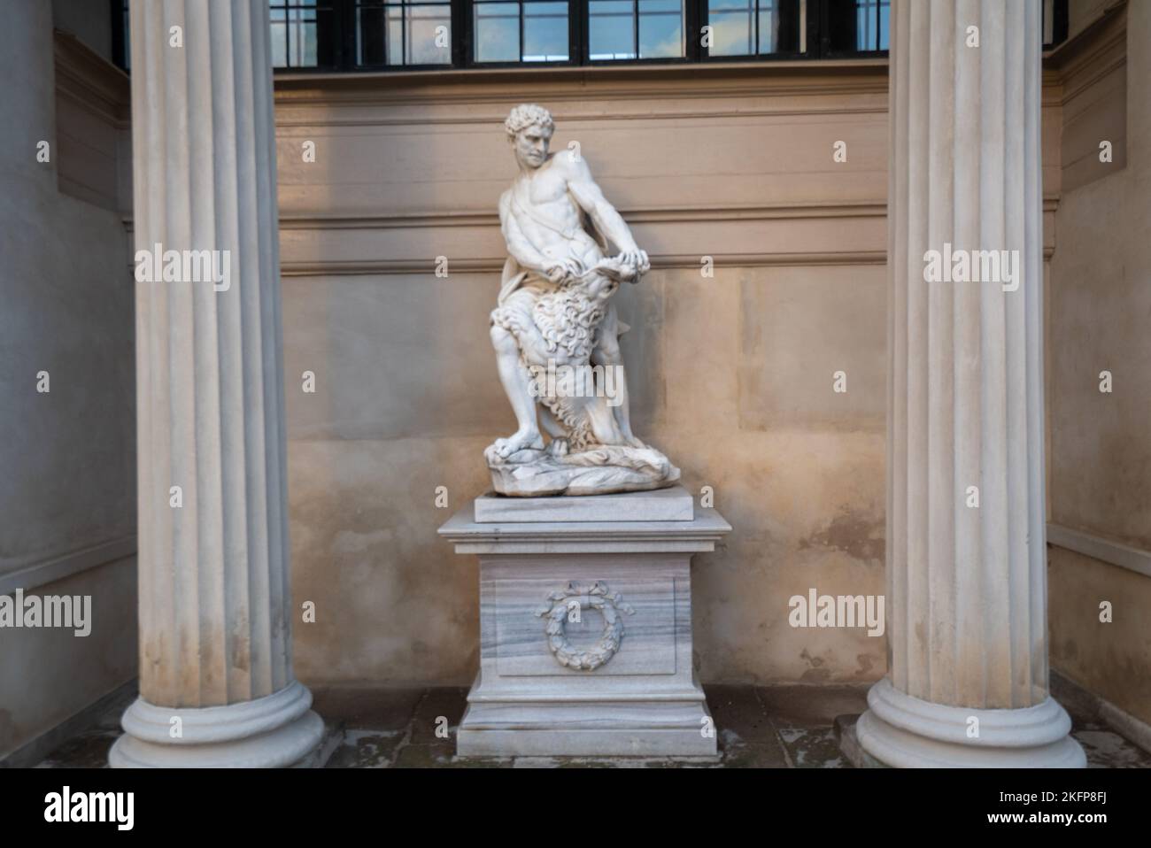 Giovanni Baratta's marble statue of Hercules in front of the Hercules Pavilion (Herkulespavillonen) in Rosenborg Castle Gardens, Copenhagen, Denmark. Stock Photo