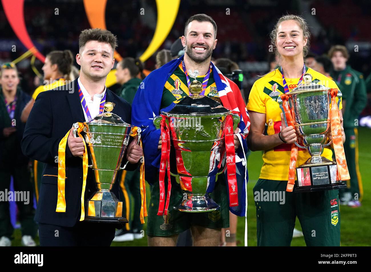Australia's James Tedesco (centre) with the men's trophy, Australia's Kezie Apps (right) with the women's trophy and England's Tom Halliwell with the wheelchair trophy after the Rugby League World Cup final at Old Trafford, Manchester. Picture date: Saturday November 19, 2022. Stock Photo