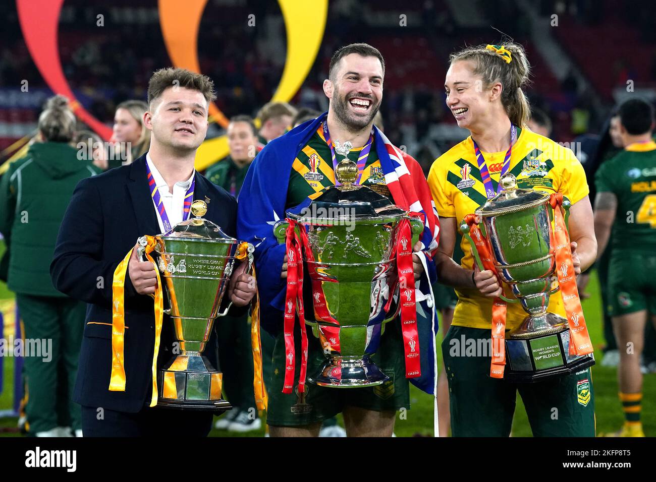 Australia's James Tedesco (centre) with the men's trophy, Australia's Kezie Apps (right) with the women's trophy and England's Tom Halliwell with the wheelchair trophy after the Rugby League World Cup final at Old Trafford, Manchester. Picture date: Saturday November 19, 2022. Stock Photo