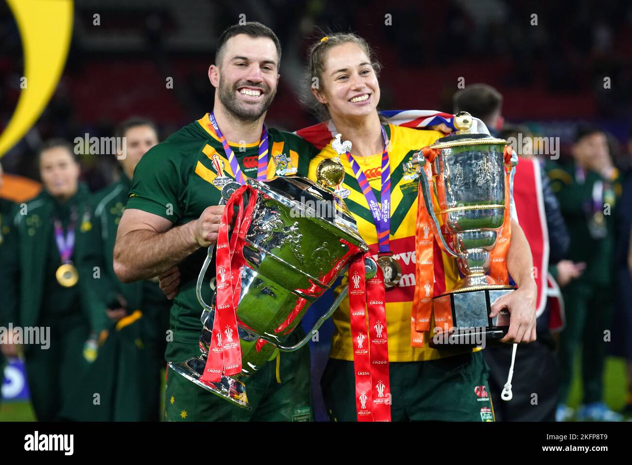 Australia's James Tedesco (left) with the men's trophy and Australia's Kezie Apps with the women's trophy after the Rugby League World Cup final at Old Trafford, Manchester. Picture date: Saturday November 19, 2022. Stock Photo
