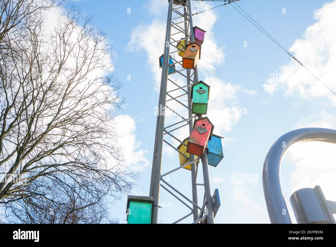 Decorated and colourful bird boxes in Copenhagen, Denmark. Multicoloured nesting boxes in the city streets of Copenhagen. Urban rewilding / re-wilding Stock Photo