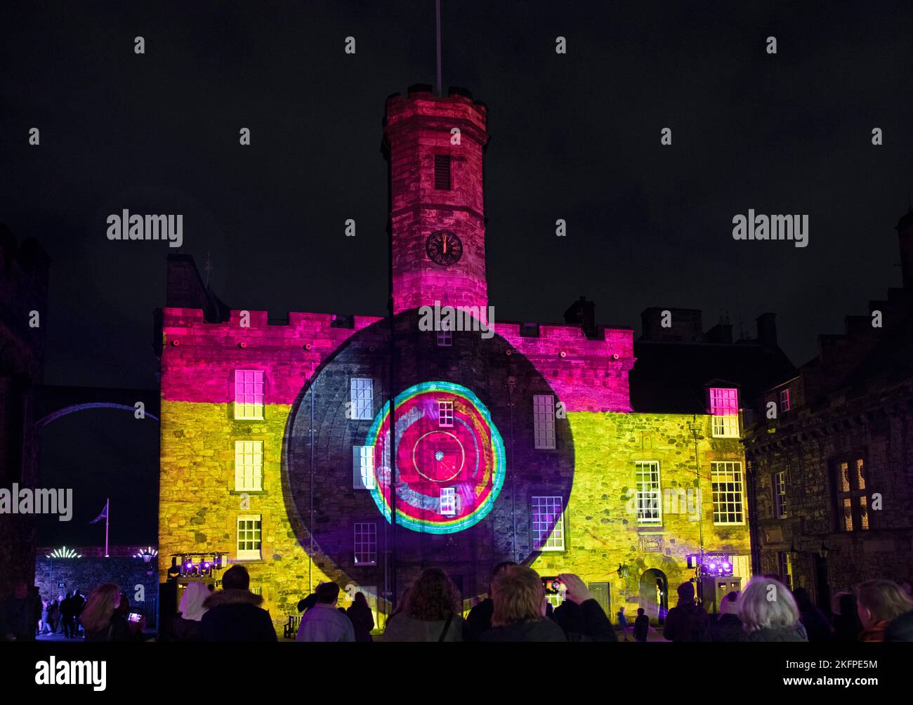 Edinburgh Castle, Edinburgh, Scotland, UK. 19 November 2022. Hundreds turned out on a cold Saturday to see the Castle of Light, Edinburgh's skyline sparkles and glistens in brilliant colour as the 2nd night of 'Kingdom of Colours' 2022 event kicks off with projections and illuminations on the castle's ancient walls. The preview event on Thursday had to be postponed due to a wet weather yellow warning for the area. Various themes ran throughout including The Beatles Yellow Submarine and other sixties tunes as well as Scottish History. Credit: Arch White/alamy live news. Stock Photo