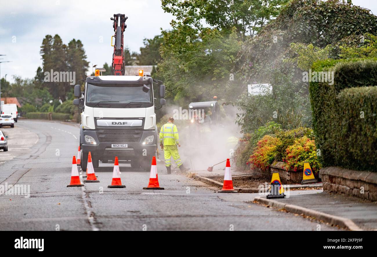 Repairs on a pavement in the Scottish market town of Lockerbie, Dumfries and Galloway, UK Stock Photo