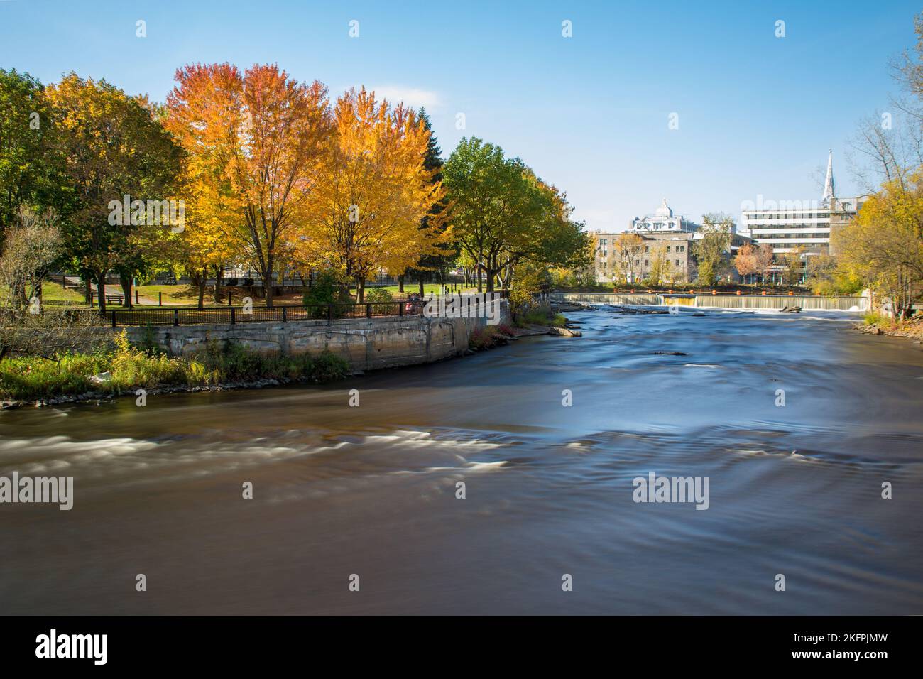 Slow motion streaming water. Waterfalls in L'Assomption river, Joliette