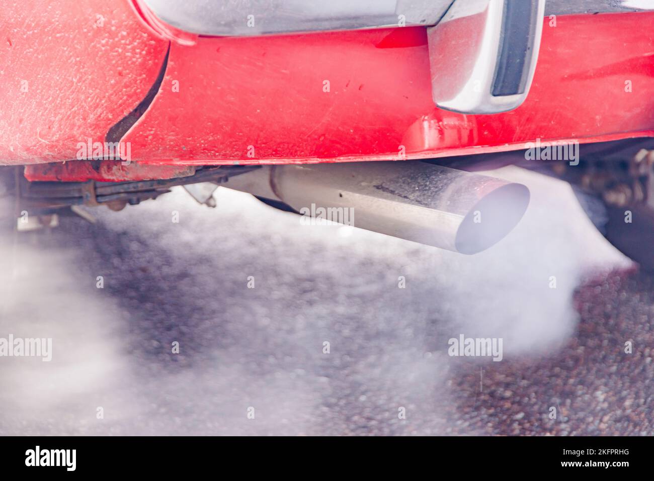 combustion fumes coming out of car exhaust pipe, exhaust gas from a car