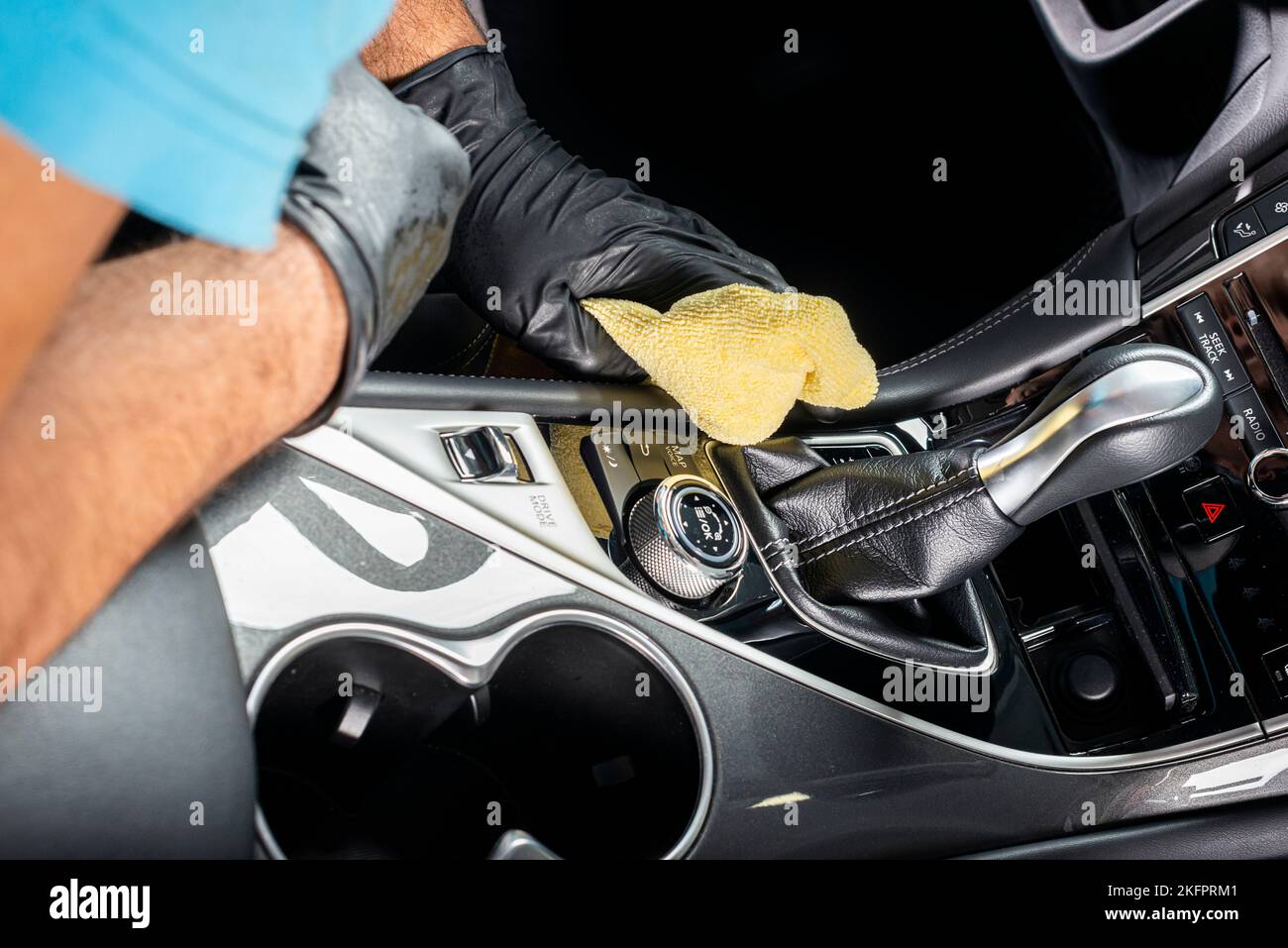 A man cleaning car interior, car detailing in Carwash service Stock Photo