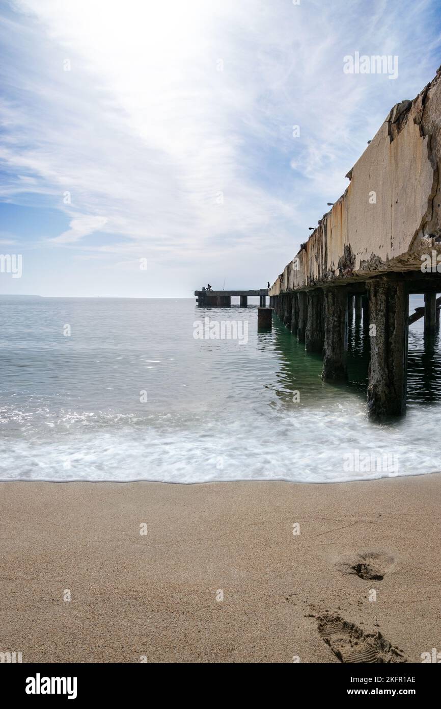 A vertical shot of the Pontile di Ostia observation deck on the beach in Italy Stock Photo