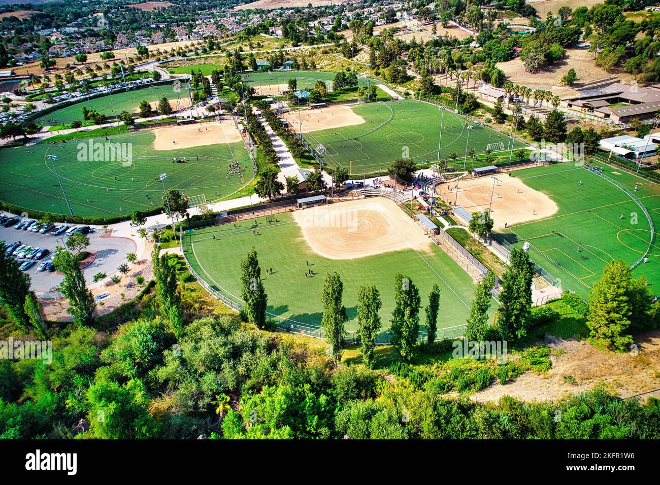 A drone view of a multi-use playfield with football and softball diamonds Stock Photo