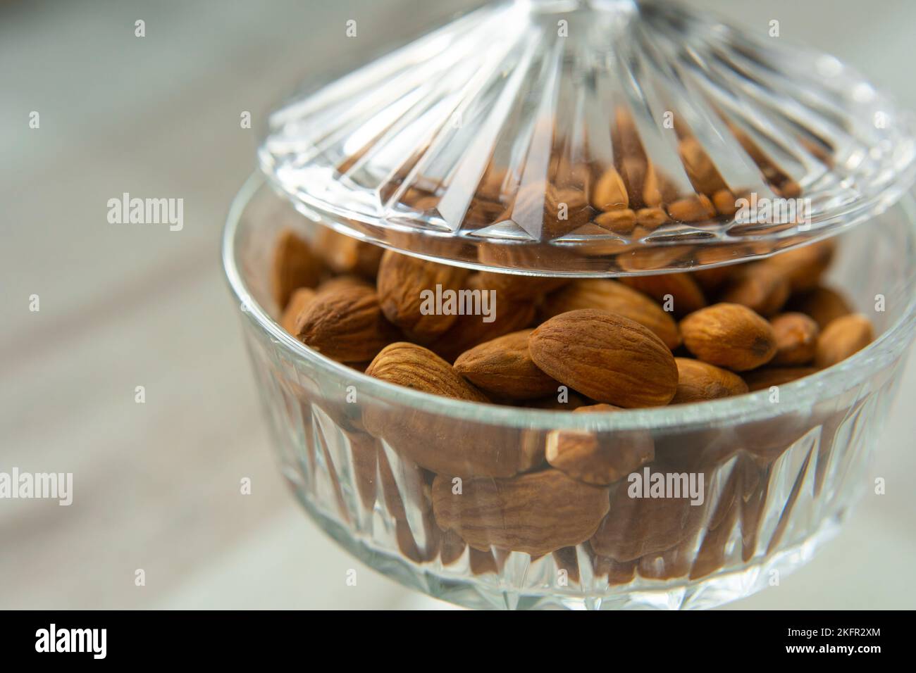Close-up of almonds on a beautiful stand, Nuts are healthy. Organic food. Stock Photo