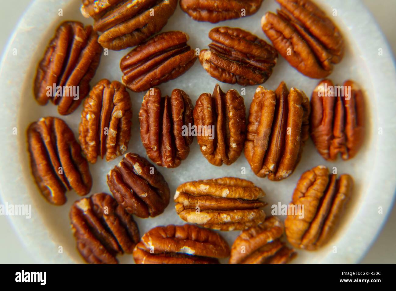 Walnut plan, pecan halves on a beautiful stand, Nuts are healthy