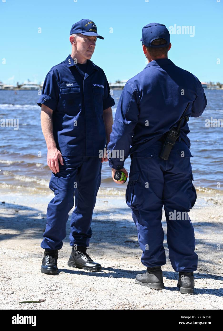 Vice Adm. Kevin E. Lunday, commander, Atlantic Area, speaks with Coast Guard personnel assigned to the Gulf, Atlantic and Pacific Strike teams in Matlacha Isles, Florida, Oct. 2, 2022. Lunday visited members who responded in the wake of Hurricane Ian. U.S. Coast Guard photo by Petty Officer 3rd Class Ian Gray. Stock Photo