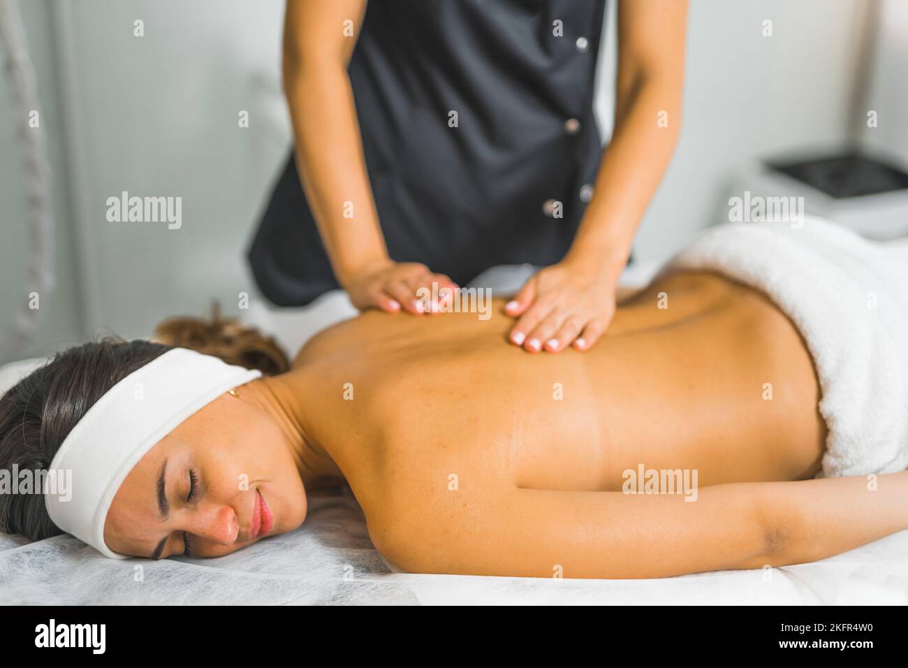 Back Ache Massage, Woman View From Behind Stock Photo, Picture and Royalty  Free Image. Image 18632578.