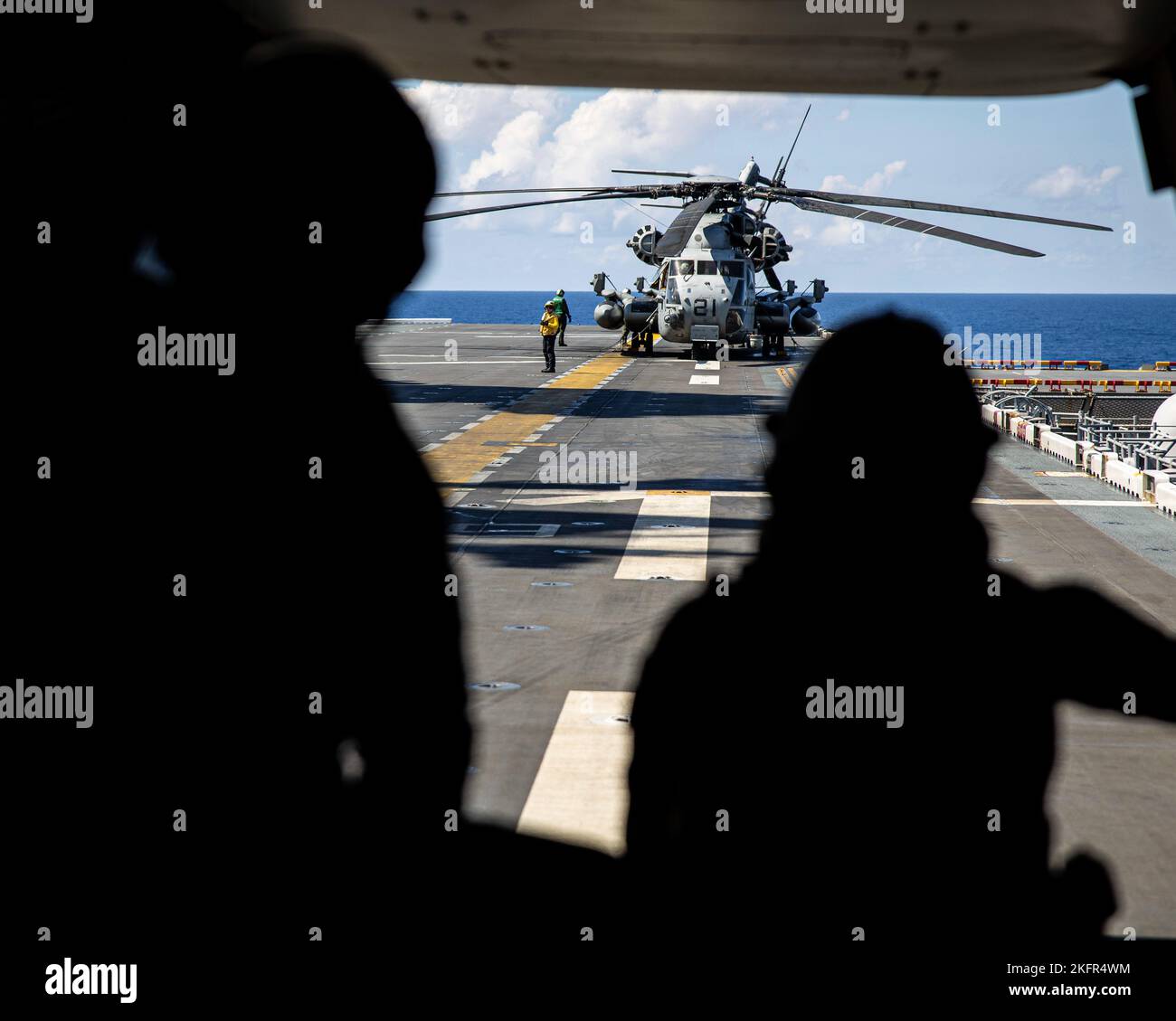 U.S. Marines with Marine Medium Tiltrotor Squadron (VMM) 262 (Rein.), 31st Marine Expeditionary Unit, prepare for flight operations inan MV-22B Osprey during KAMANDAG 6 aboard Amphibious Assault Ship USS Tripoli (LHA-7), off the coast of the Philippines, Oct. 2, 2022.  KAMANDAG is an annual bilateral exercise between the Armed Forces of the Philippines and U.S. military designed to strengthen interoperability, capabilities, trust, and cooperation built over decades shared experiences. Stock Photo