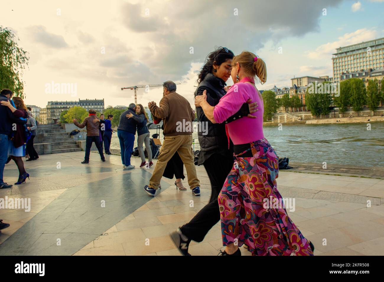 Paris Dancing Riverside 05-15-2016 Paris. Lovely parisian couples dancing tango and pople ...