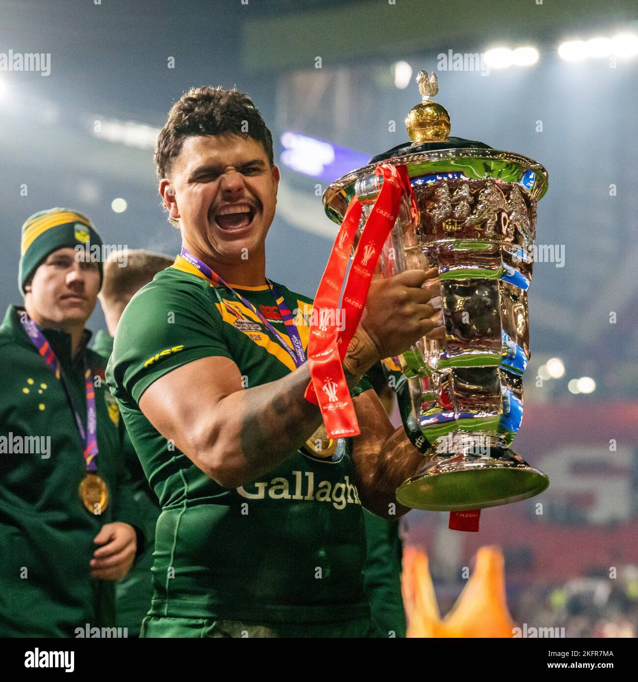 Manchester, UK. 18th Nov, 2022. Latrell Mitchell (South Sydney Rabbitohs) of Australia (8) with he World Cup Trophy after winning the 2021 Rugby League World Cup Final 2021 match between Australia and Samoa at Old Trafford, Manchester, England on 19 November 2022. Photo by David Horn. Credit: PRiME Media Images/Alamy Live News Stock Photo