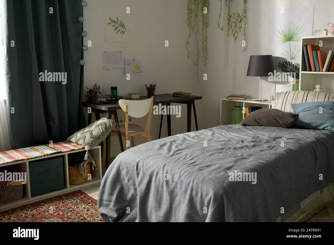 Horizontal image of modern big bedroom for child with comfortable bed