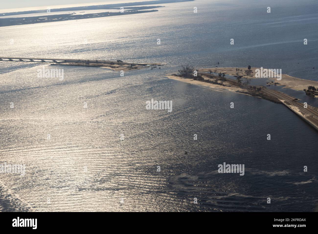 Aerial shot showing damage caused by Hurricane Ian to the Sanibel Causeway near Cape Coral, Florida, October 3, 2022.  The causeway, which is temporarily closed, is the only land-travel access road between Sanibel Island and mainland Florida. Stock Photo