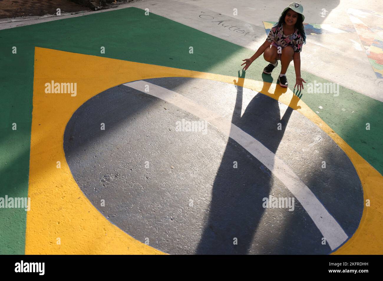 A child poses for a photo on the Third Street of the Alvorada neighbourhood which is decorated for the upcoming 2022 FIFA World Cup Qatar, in Manaus, Amazonas state, Brazil November 19, 2022. REUTERS/ Bruno Kelly Stock Photo