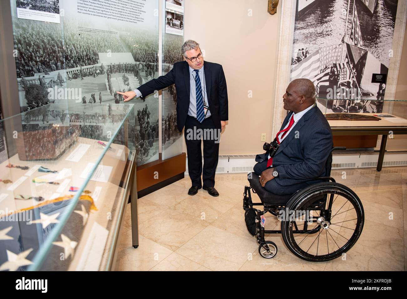 Rob Gainer (left), historian, Arlington National Cemetery, gives a tour of the Memorial Amphitheater Display Room to U.S. Army Col. (ret.) Gregory Gadson (right) at Arlington National Cemetery, Arlington, Va., Oct. 4, 2022. Gadson was at ANC to speak to employees as part of the National Disability Employment Awareness Month. He also participated in a Public Wreath-Laying Ceremony at the Tomb of the Unknown Soldier. Gadson has dedicated himself to the work of Wounded Warriors, veterans, and other groups who support employment and betterment of person with disabilities. Stock Photo