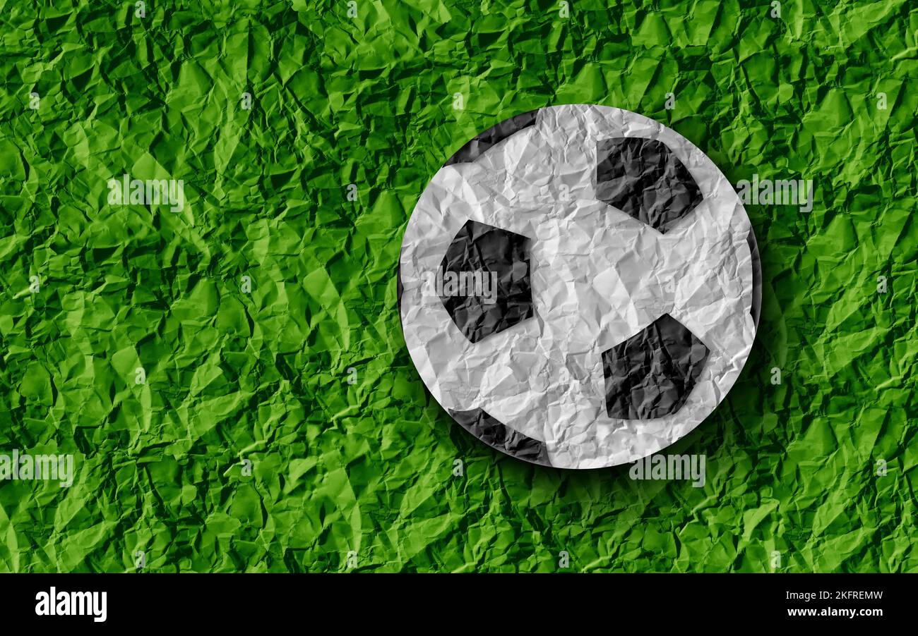 Football Soccer Background and sport as a grass sports field with a european game football on a green paper turf Stock Photo