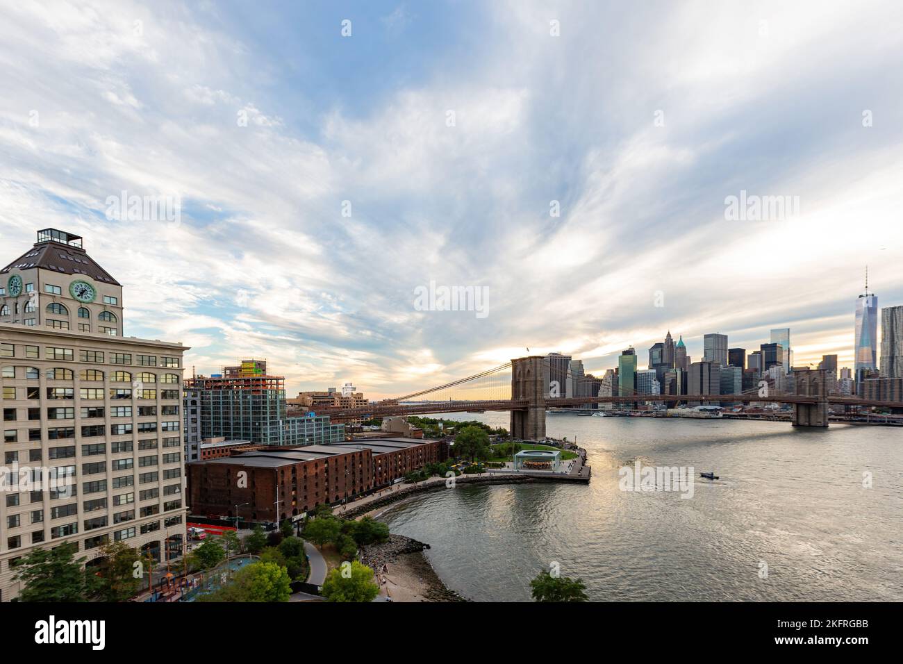 Sunset afterglow of the Brooklyn Bridge and New York City skyline at ...