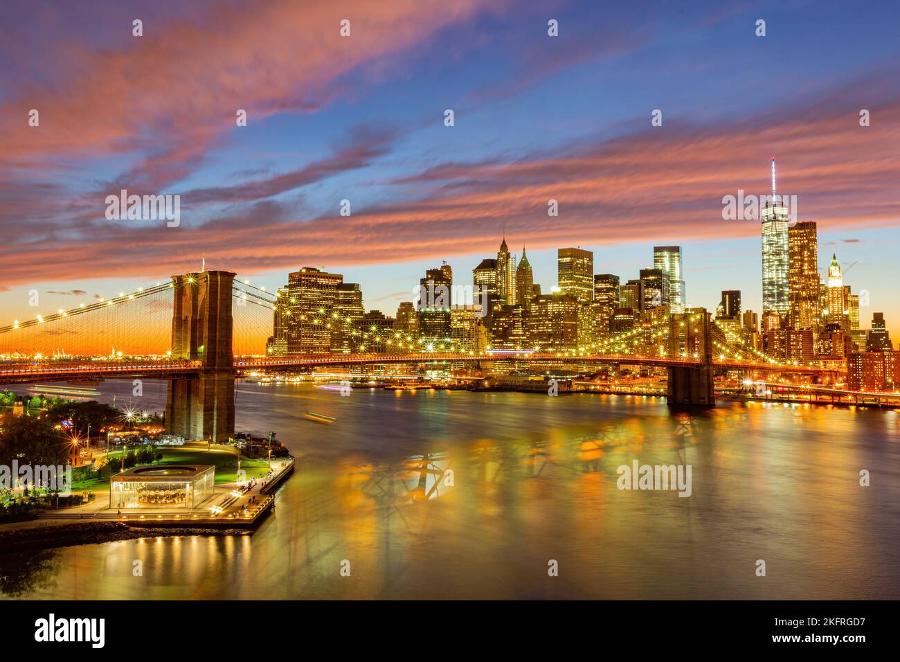 Sunset afterglow of the Brooklyn Bridge and New York City skyline at ...