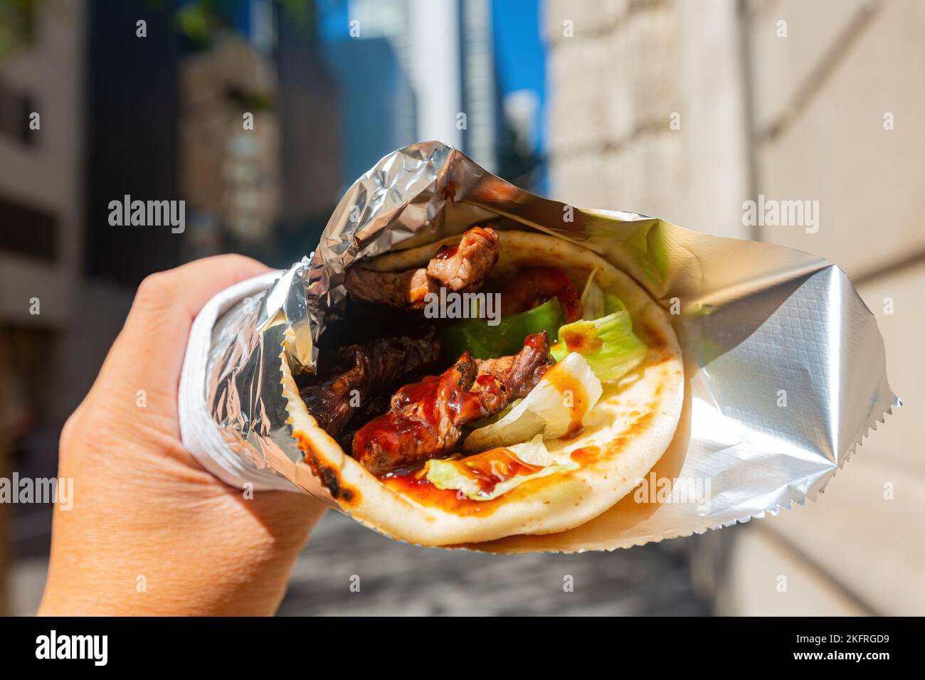 Close up shot of Mexican style beef wrap taco at New York Stock Photo