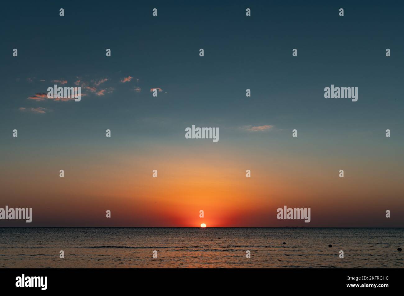 Sunset on sea. Surface on sunset. Water background Stock Photo