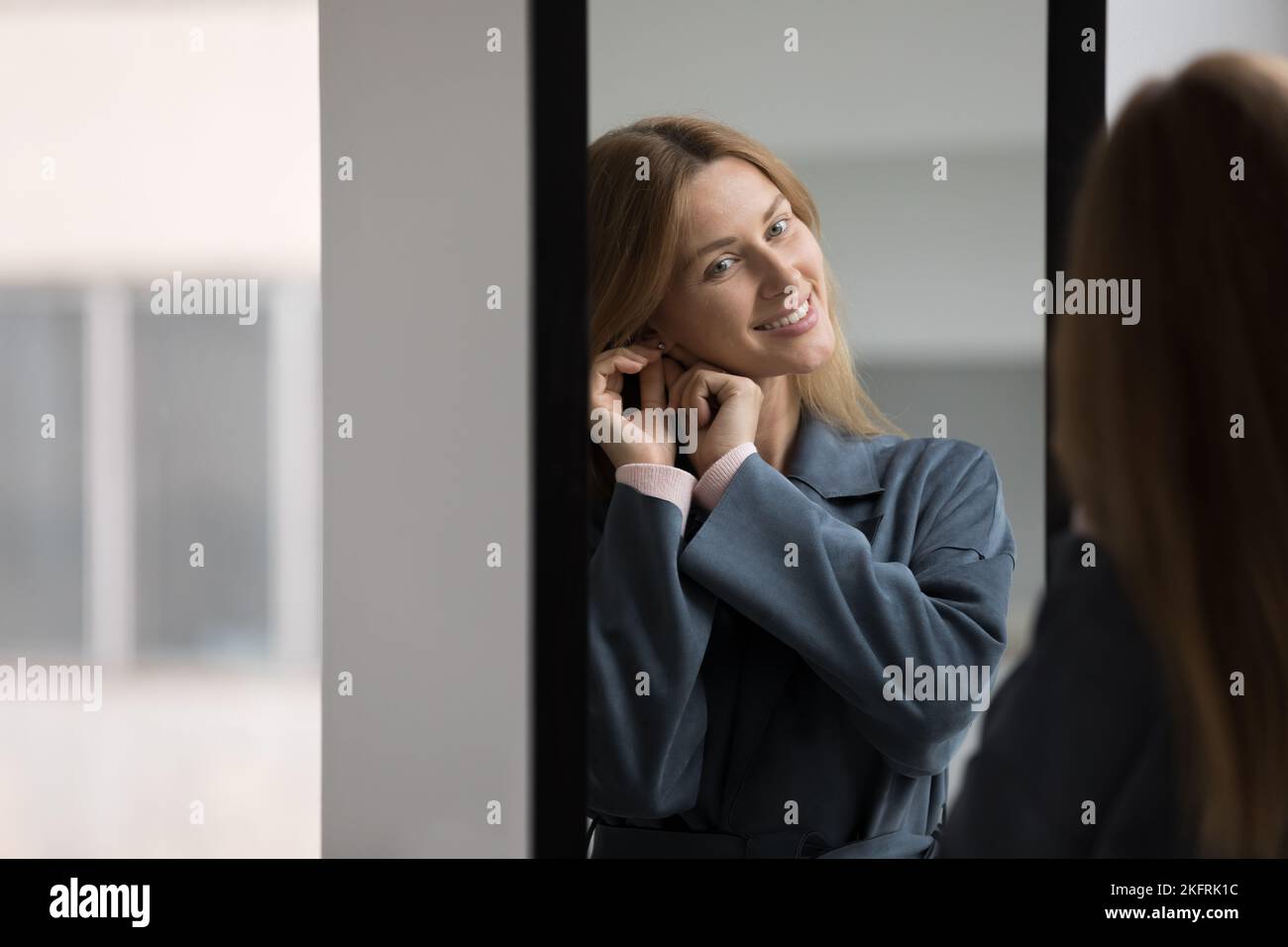 Woman with earrings hi-res stock photography and images - Alamy