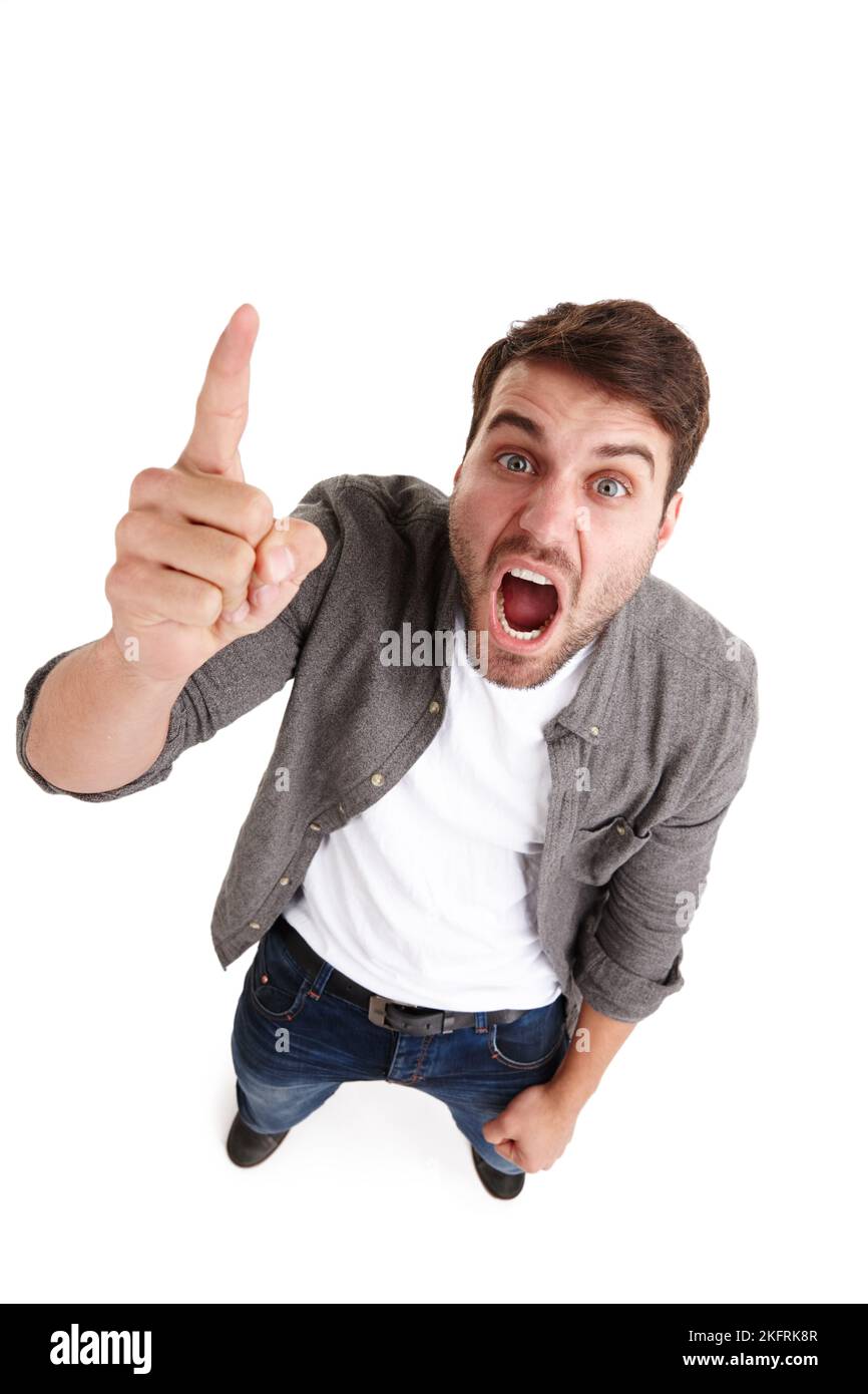 If your employees look like this, you need help. High-angle portrait of an angry young man in studio shaking his finger and shouting. Stock Photo