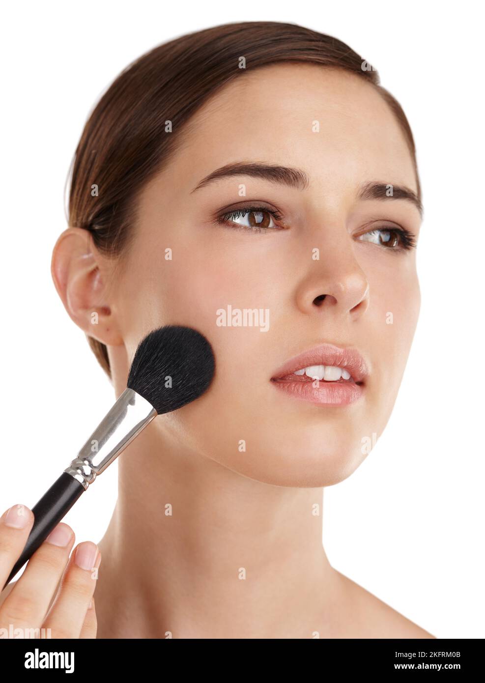 Giving definition to a natural beauty. a beautiful young woman applying