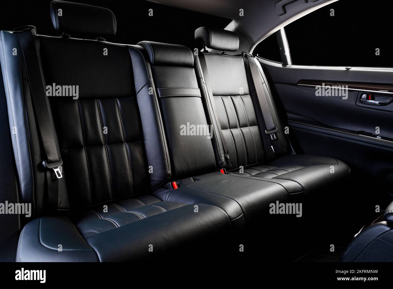 Modern luxury car leather interior. Comfortable perforated leather back seats. Perforated leather. Car detailing. Stock Photo