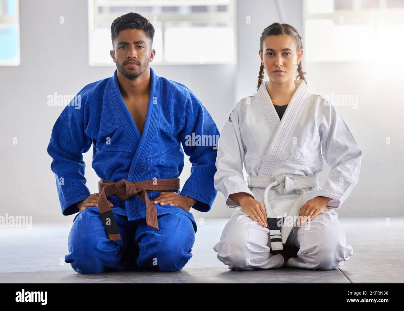Karate, man and woman in portrait together with focus determination for