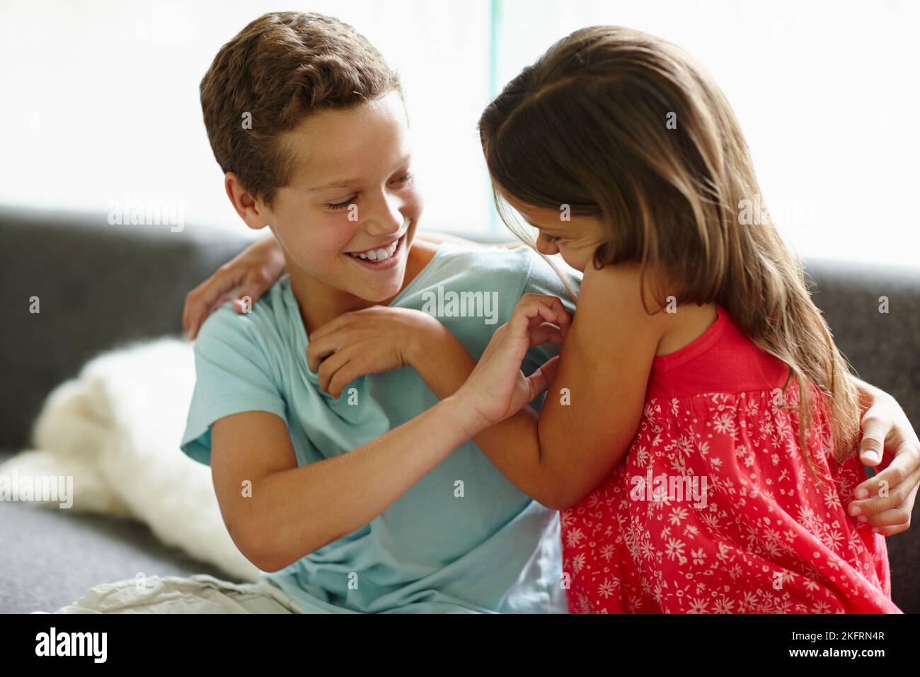 Tickle Fight A Brother And Sister Tickling Each Other While On The