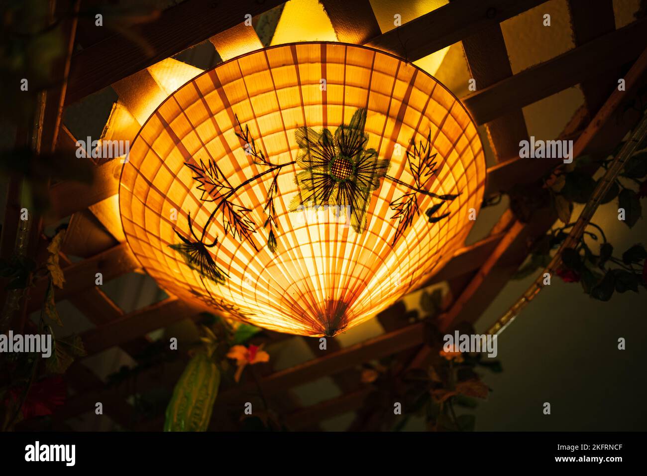 Ceiling lantern made from bamboo weave in Asian traditional style. Chinese lanterns during new year festival ,color toned. Nobody, selective focus Stock Photo