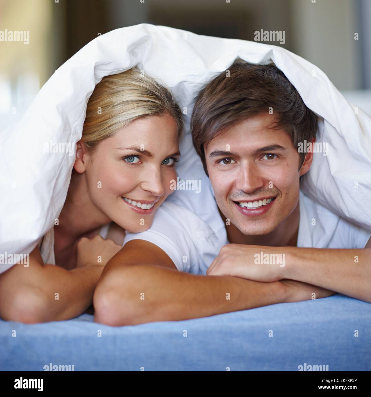 Covered in love. a happy young couple enjoying a playful moment ...