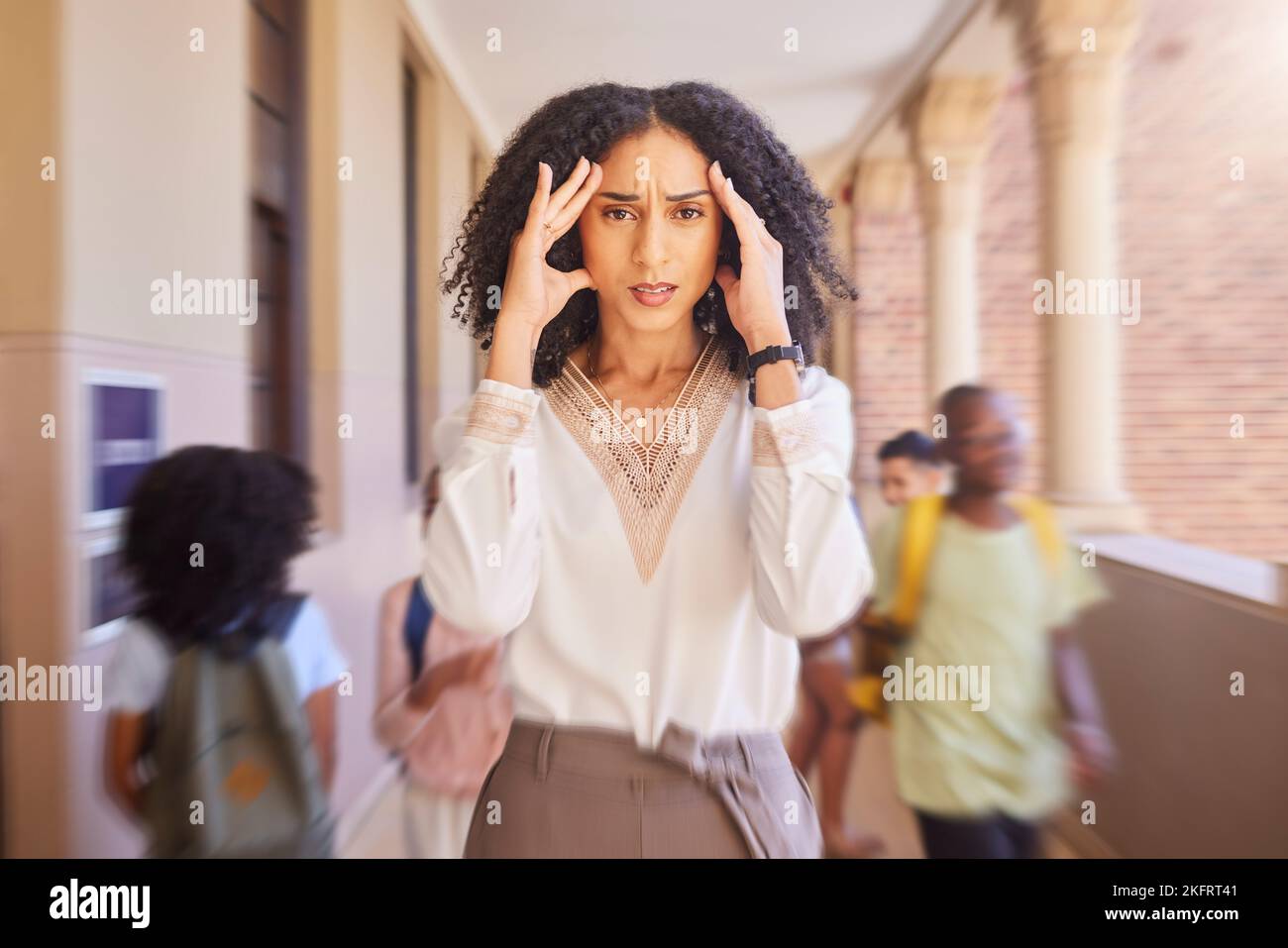 Black woman, teacher and headache stress at school, academy or learning campus with blurred background. Africa woman, portrait and pain for mental Stock Photo