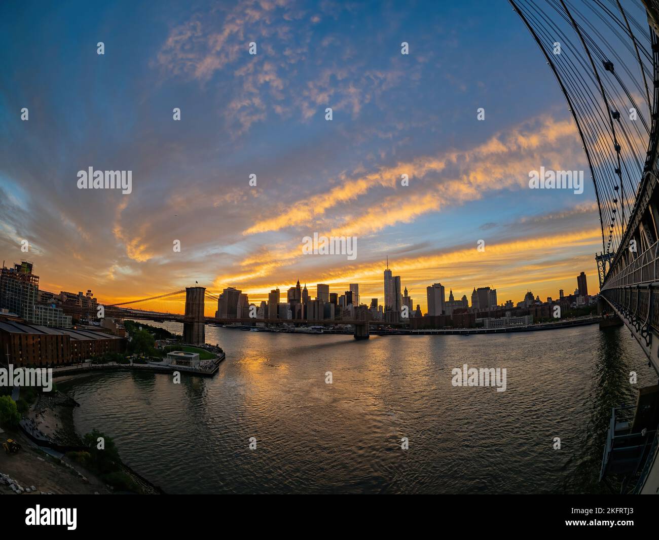 Sunset afterglow of the Brooklyn Bridge and New York City skyline at ...