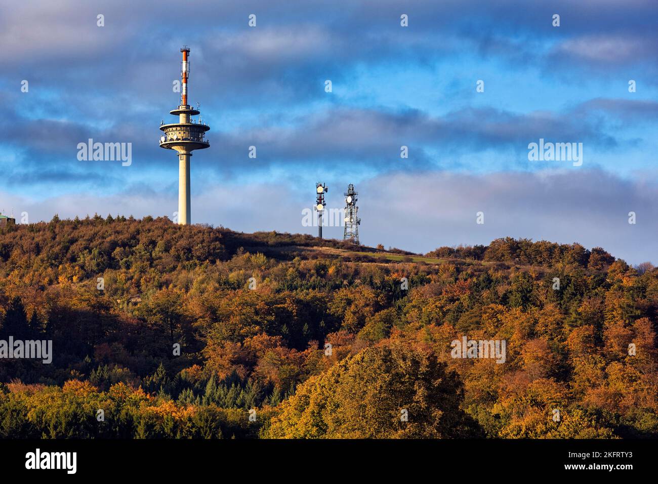 Mountain top with telecommunications tower Köterberg and two transmission masts, sunny autumn weather, Bödexen, Höxter, Weserbergland, North Rhine-Wes Stock Photo