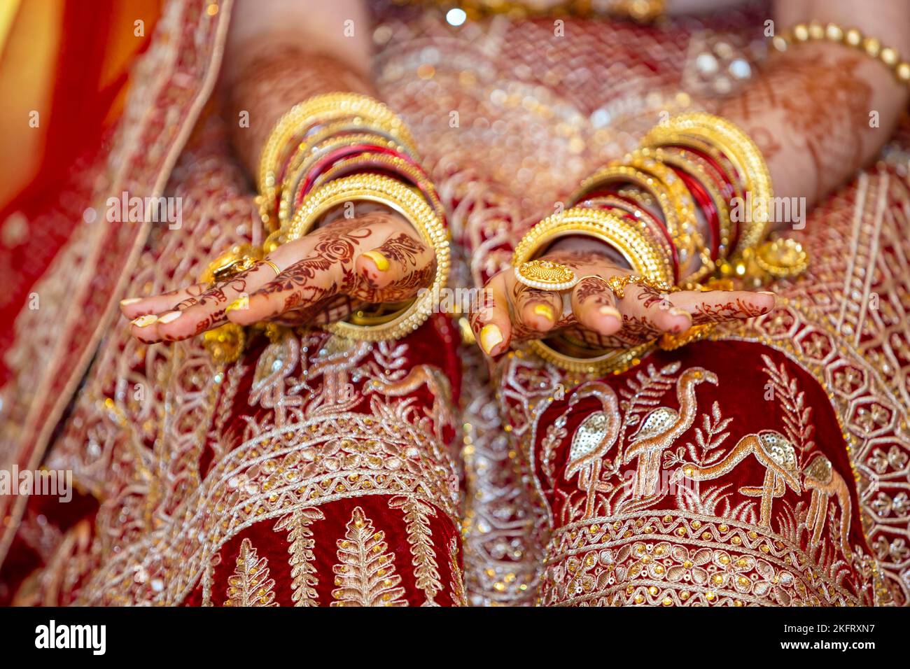 Traditional bridal jewelry and henna decoration on the hands of Hindu