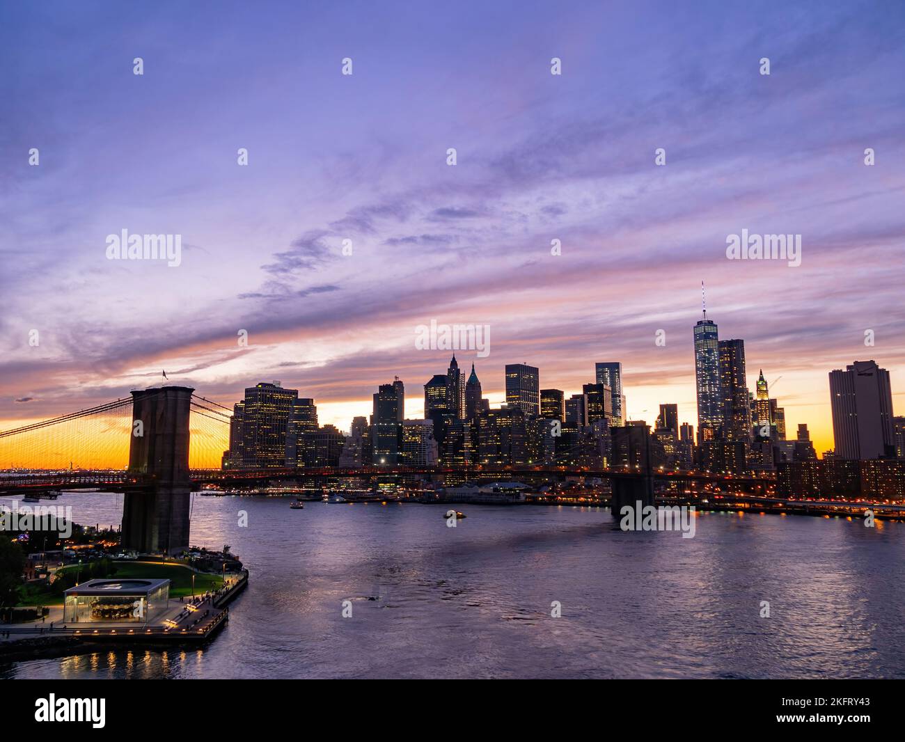 Sunset afterglow of the Brooklyn Bridge and New York City skyline at ...