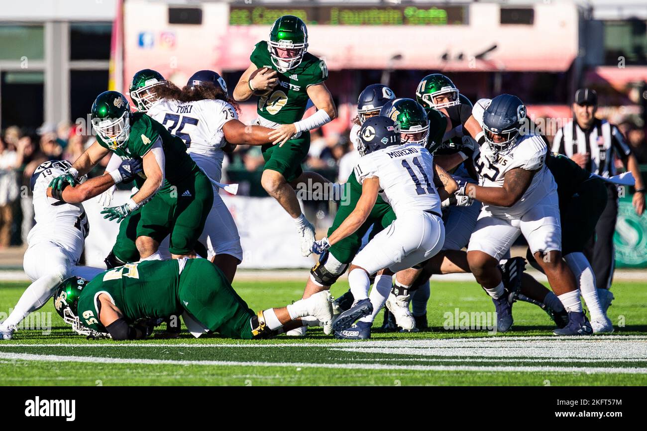 Hornet Stadium. 19th Nov, 2022. U.S.A. Sacramento State quarterback Asher O'Hara (10) jumps over a pile for the first down during the NCAA Causeway Classic Football game between UC Davis Aggies and the Sacramento State Hornets. Sacramento State beat UC Davis 27-21 at Hornet Stadium. Thurman James/CSM/Alamy Live News Stock Photo