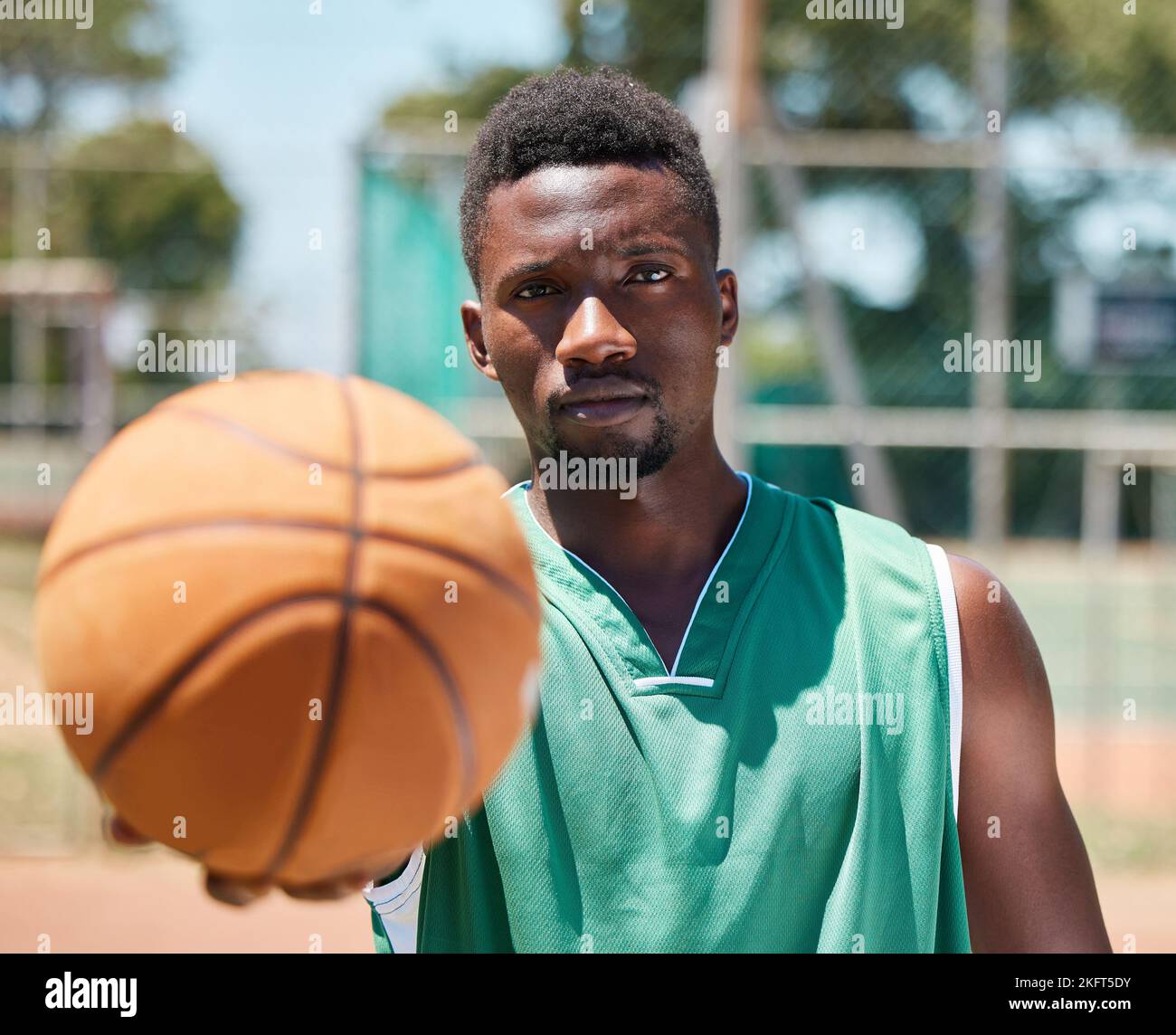 Basketball, serious face and black man ready for fitness, training and sports game outdoor. Portrait of a athlete before exercise, wellness and body Stock Photo