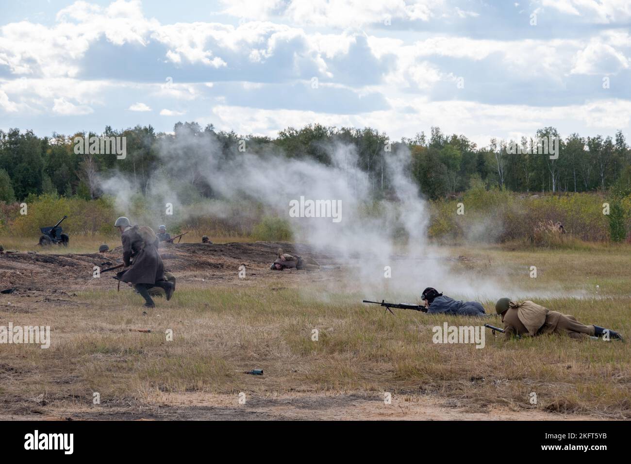 Battle of Soviet and German soldiers. Attack of Soviet soldiers. Smoke from smoke bombs. Reconstruction of the battle of World War II. Russia, Chelyab Stock Photo