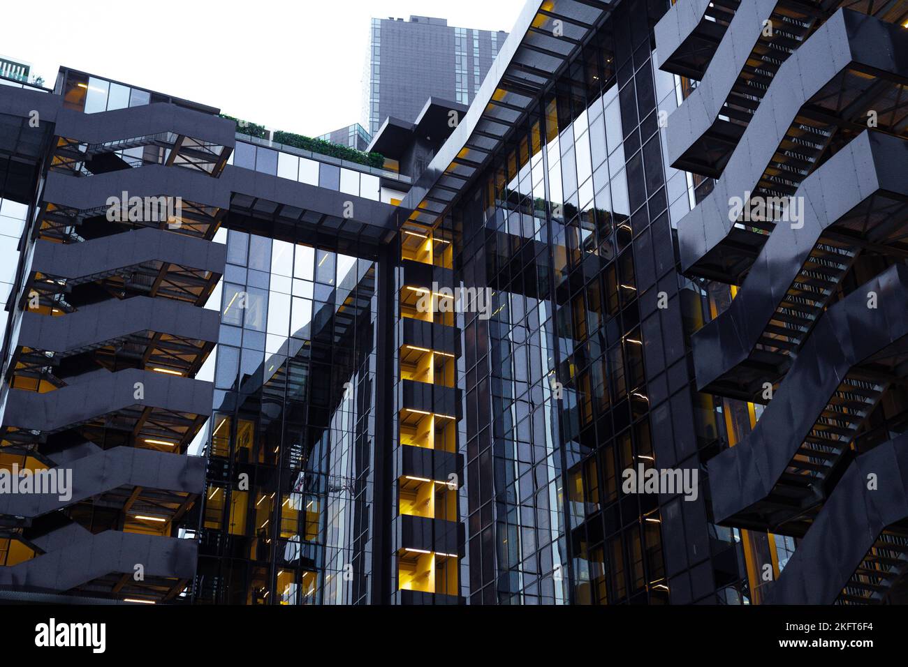 From below exterior of contemporary glass building with outdoor steps ...