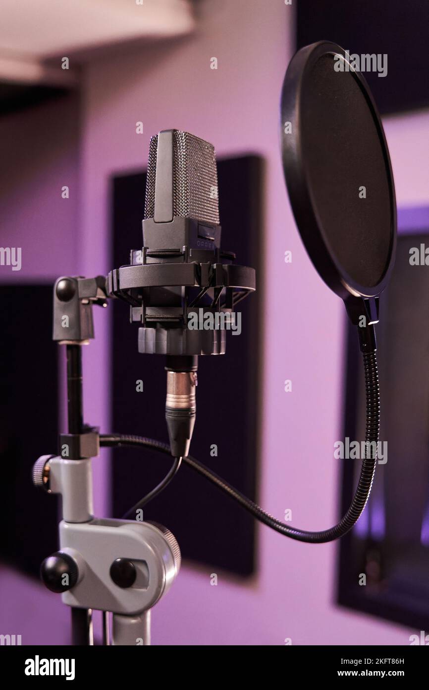 Microphone for recording for vocal singer with shock mount and pop filter on professional tripod Stock Photo