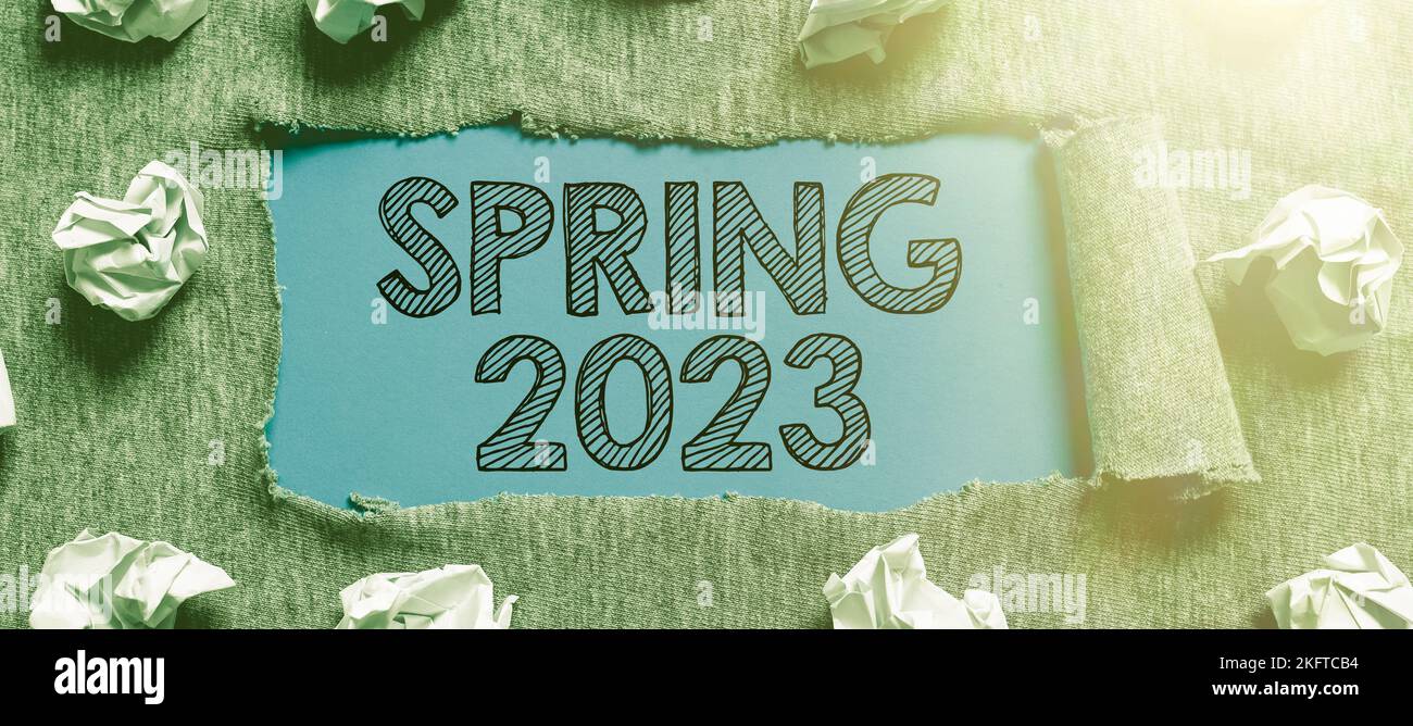 Sign displaying Spring 2023. Word Written on time of year where flowers ...