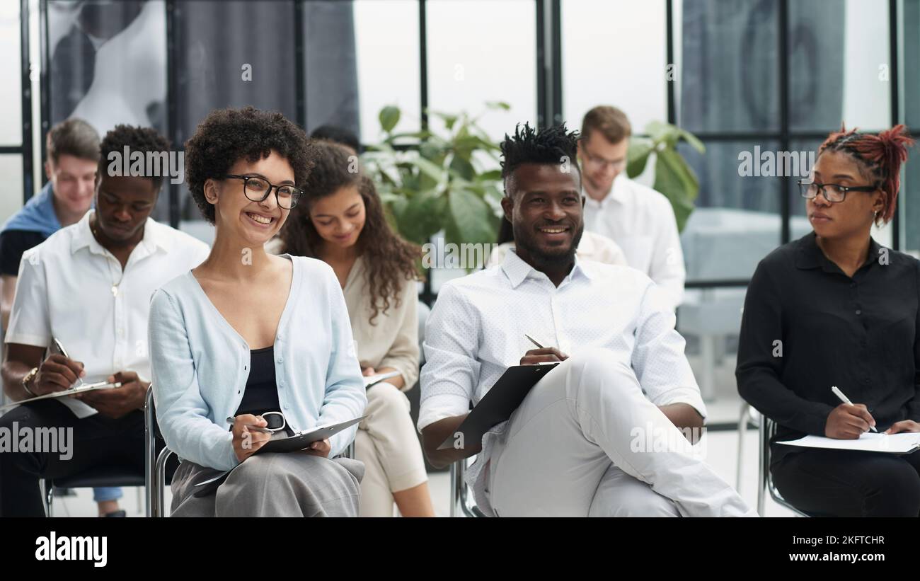 Group of People at the Business Conference in Hall. Stock Photo